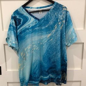 V neck top predominately teal blues with cream and white - looks like water 🌊